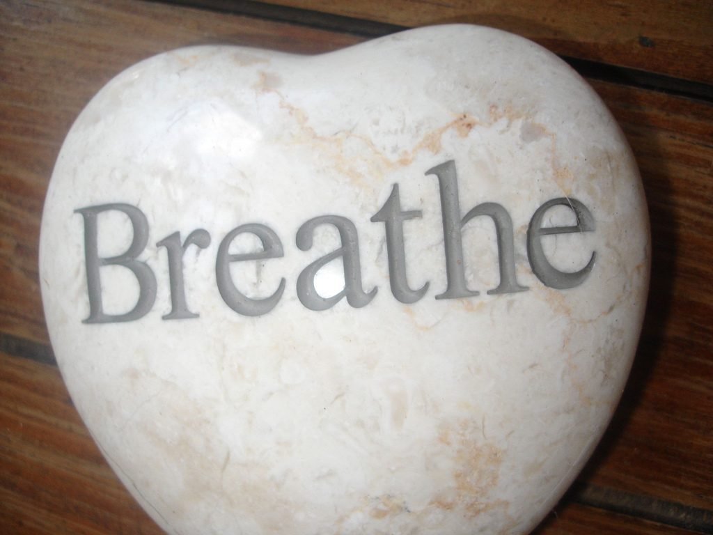Stone with breathe text