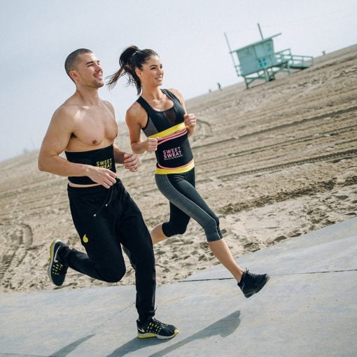 Man and woman running Sweet Sweat waist trimmer belts