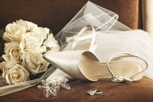 Wedding shoes with bouquet and veil